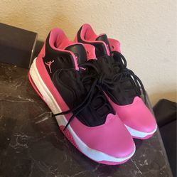 Pink and black Jordans, size 7Y.
