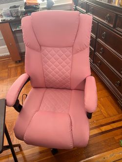 Pink desk chair with heat and massage .