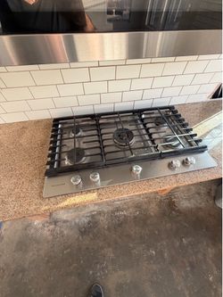 Kitchen aid microwave and cooktop.