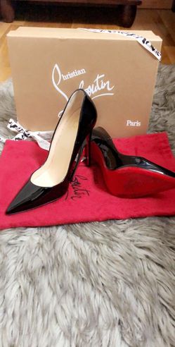 Pair of black leather pointed-toe heeled shoes