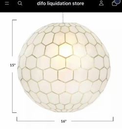 16 in. H Capiz Honeycomb Globe Pendant Light in White and Antique Gold. This Capiz Honeycomb Chandelier is handcrafted by skilled artisans in the Phi