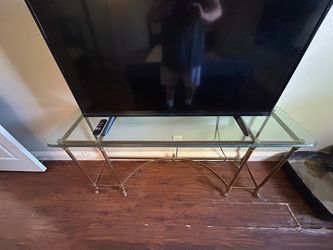 Glass and brass side table
