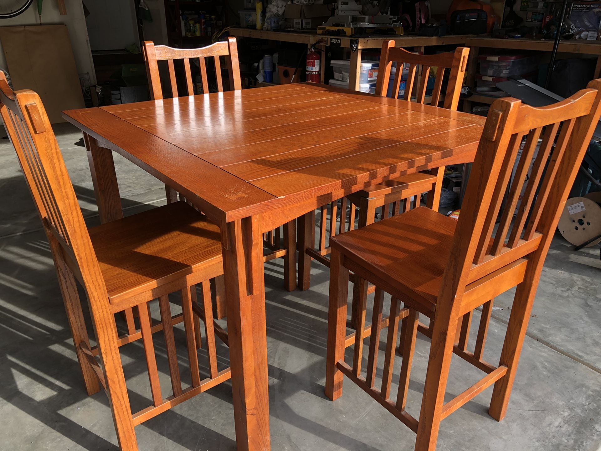 Solid wood dining pub height table with 4 chairs