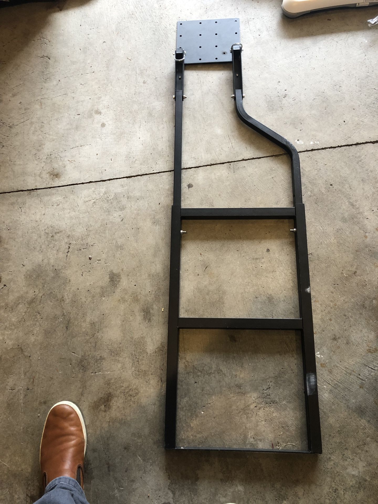 Flip up ladder truck step