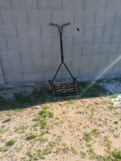 Old-fashioned lawn mower.Good for spoiled kids