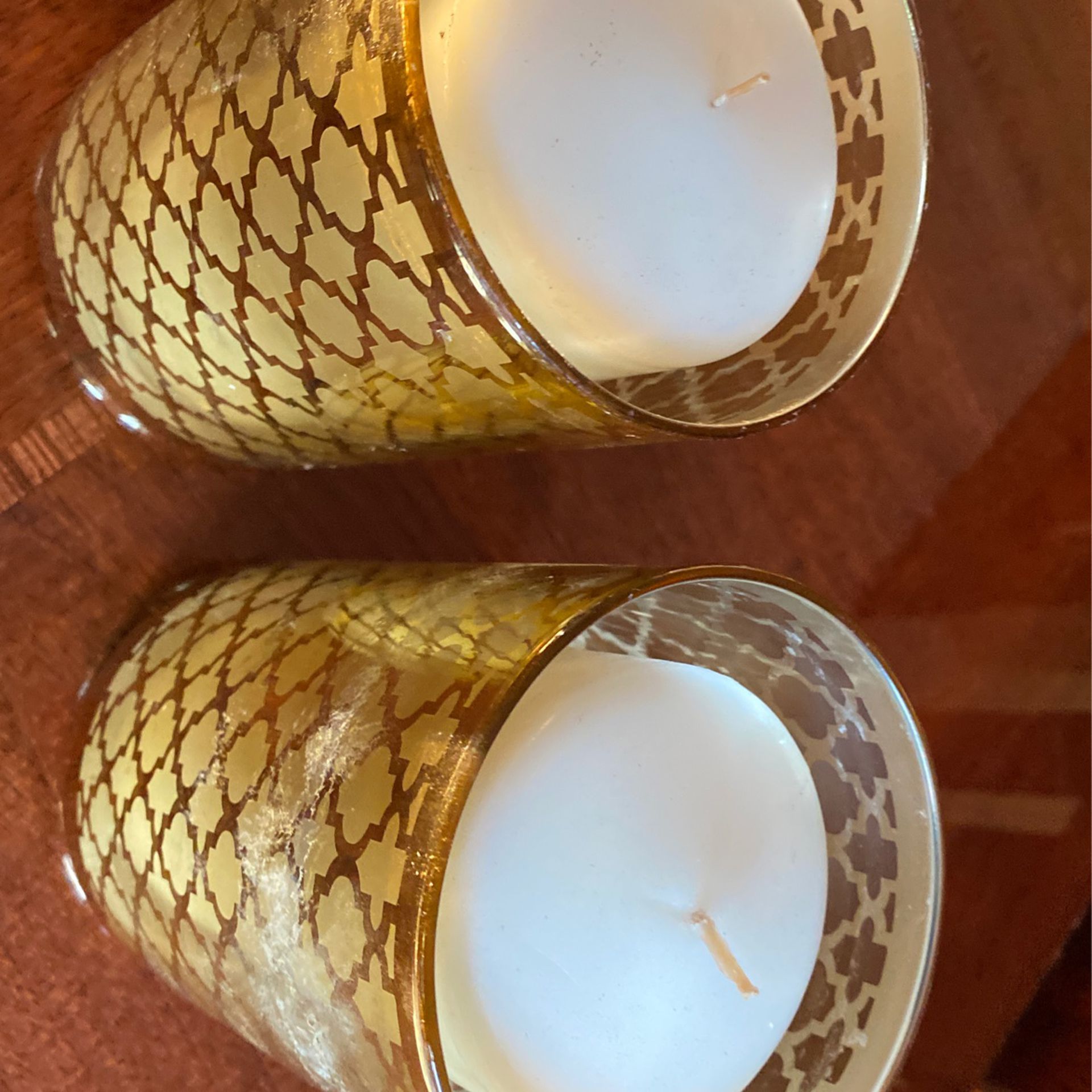 Pair of candles with holders 6 inches tall.