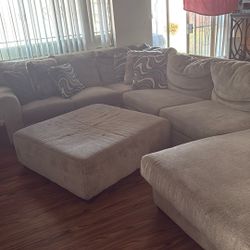 Couch w pillows and ottoman 
