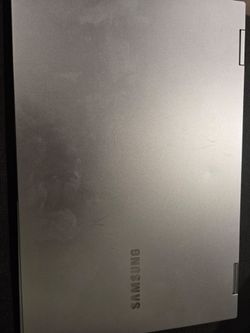 Samsung Galaxy Book convertible touchscreen laptop. Intel Core i7 processor. Works well and folds into tablet/tent mode. Normal cosmetic wear from use