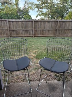 Two metal “bar top” chairs