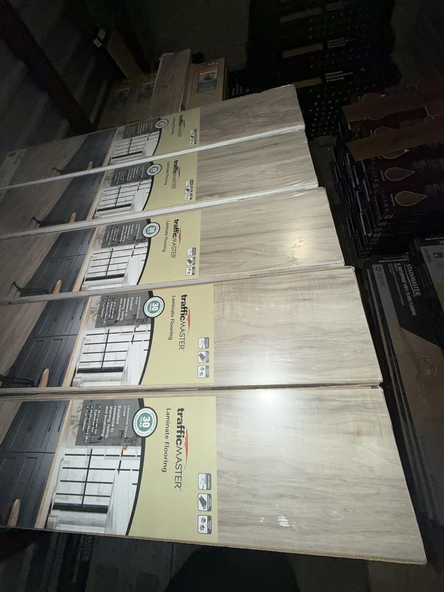 TrafficMaster Lakeshore Pecan Stone 7 mm T x 7.6 in. W Laminate Wood Flooring (24.2 sqft/case)