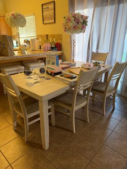 Table with 4 chairs  & bench for sale