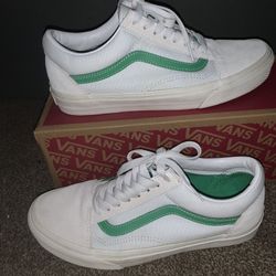 White and green Vans 