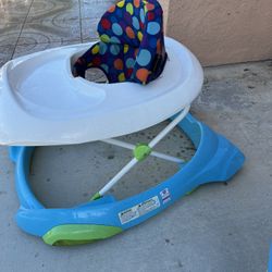 Children's walker in good condition and clean; easy to raise and lower.