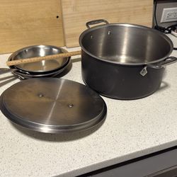 All clad  triply thick stainless 4 piece set 1x pot, 1x lid, 2x fry pans