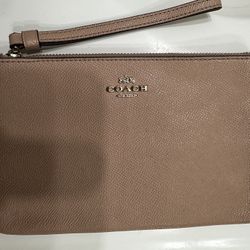 Coach large zip wristlet in peach
