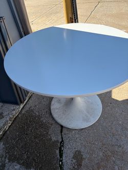 Large white round table