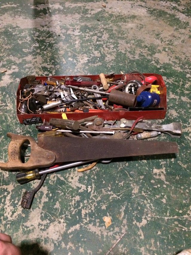 Red Tool Box Filled With Screwdrivers, Saw, Sockets, And Other Random Tools