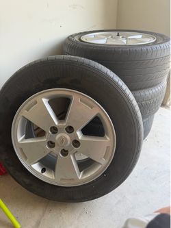 4 tires size P225 60R16 used