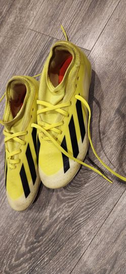 soccer cleats in the 'Solar Yellow'