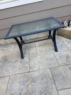 Glass top and metal outdoor coffee table