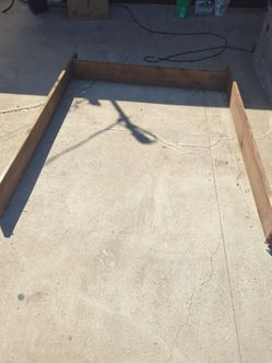 Free solid wood Cal King bed frame. No headboard