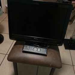 A Small TV With The Remote 