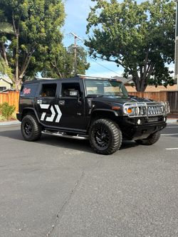 Hummer H2 Black SUV with Custom Wrap
