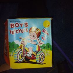 Little Boy And Girl On Tricycle Toy