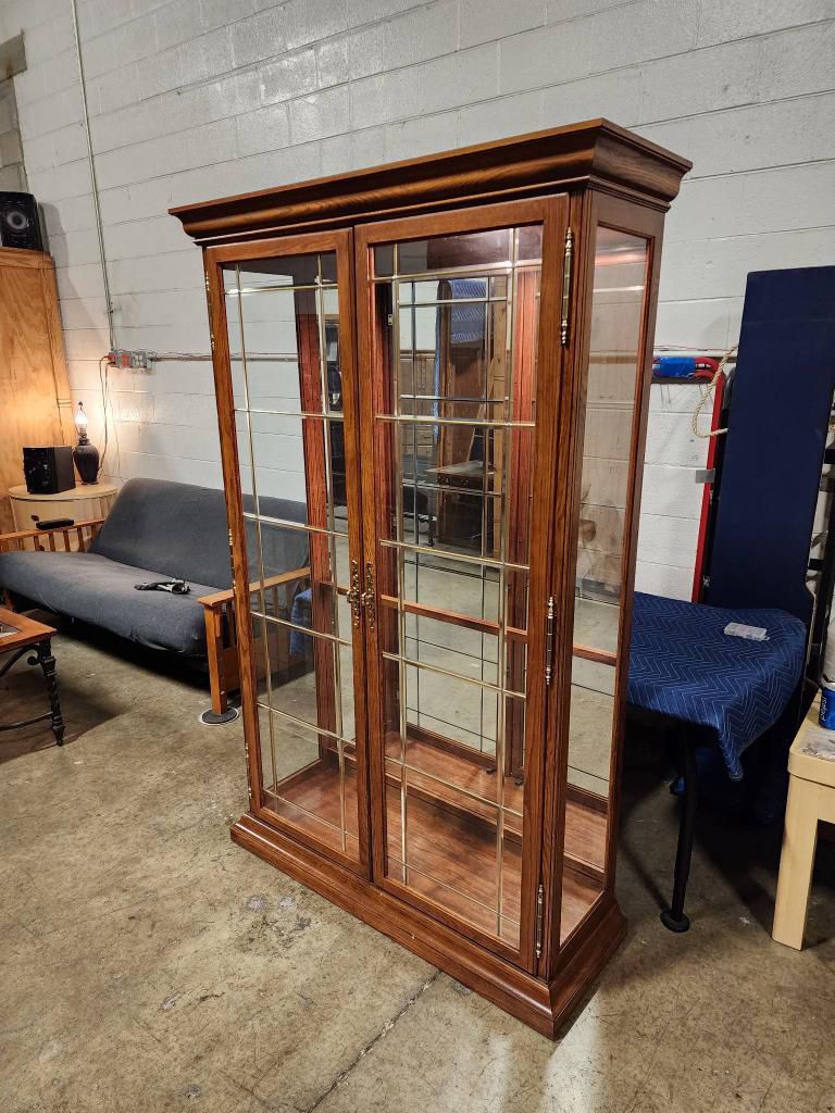 Wood And Glass China Display Cabinet With Glass Shelves And A Built In Light