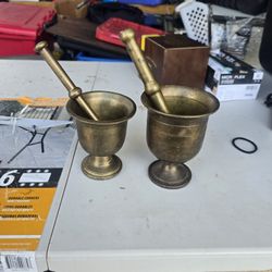 A Pair Of vintage or antique brass mortar and pestle