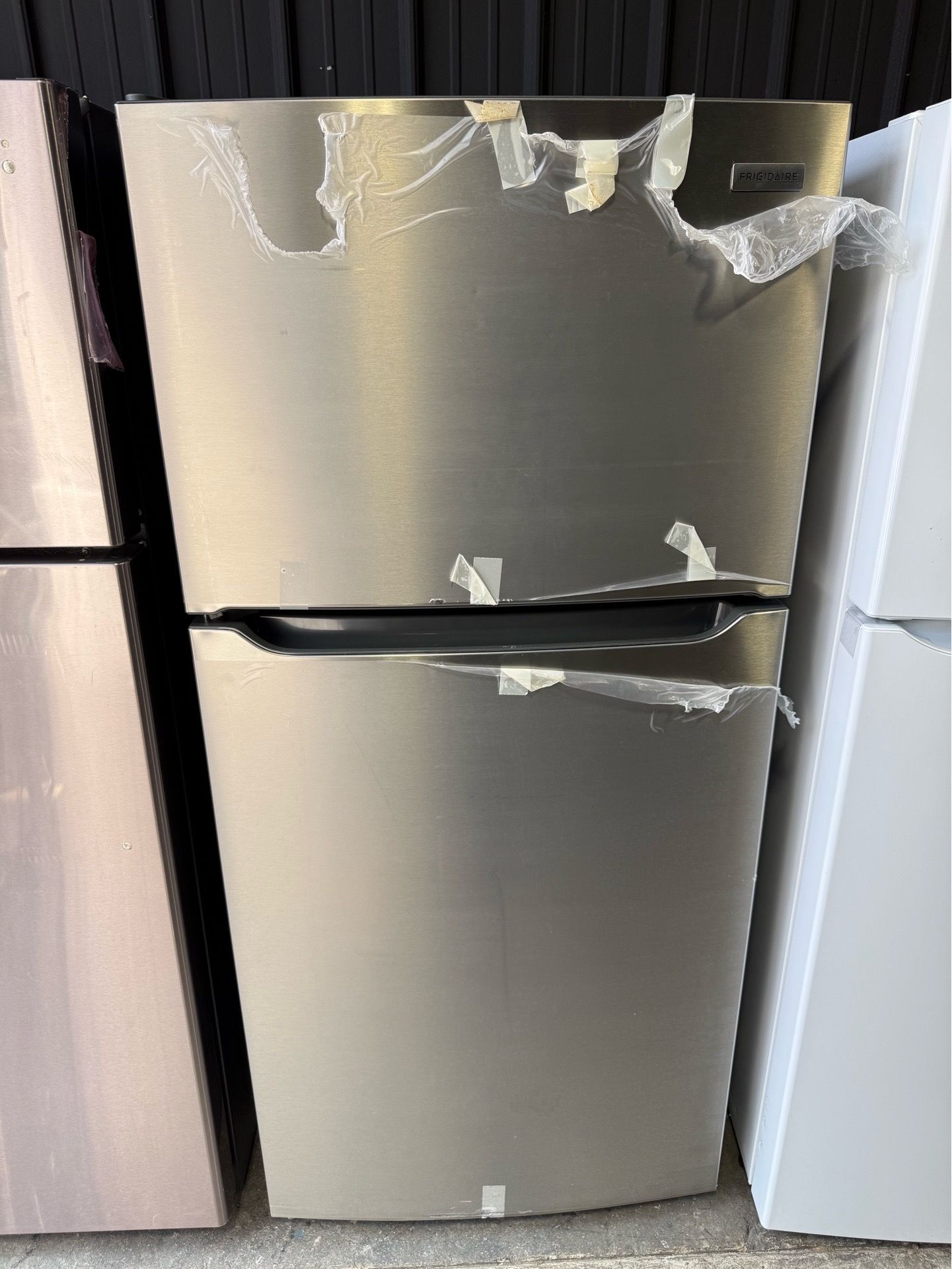 Brand new Frigidaire Stainless Steel top and bottom refrigerator