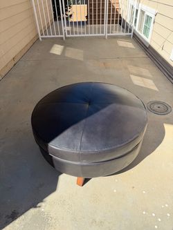 Large Round Black Leather Ottoman and black coffee table