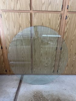 Glass table top. 50”