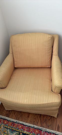 Small yellow cushioned chair