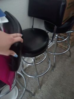 3 black leather and chrome bar stools