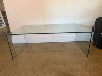 Waterfall style glass coffee table