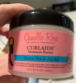 Camille Rose Curlaide Moisture Butter with a prominent pink label for Green Tea & Jojoba.