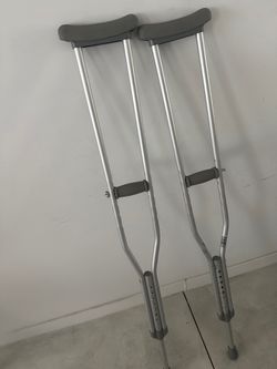 Adjustable metal crutches