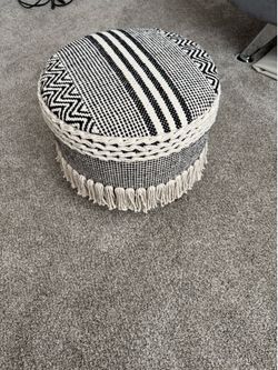 Boho black and white woven fringe ottoman