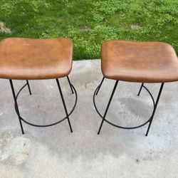 A Set Of Camel Colored Barstools 