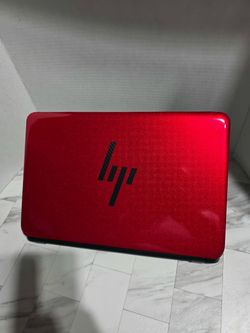 Black HP laptop with a glossy lid, full-size keyboard with numpad, built-in webcam, and Windows 10 loaded and running. FULL 15.6 SCREEN NEW BATTERY AN