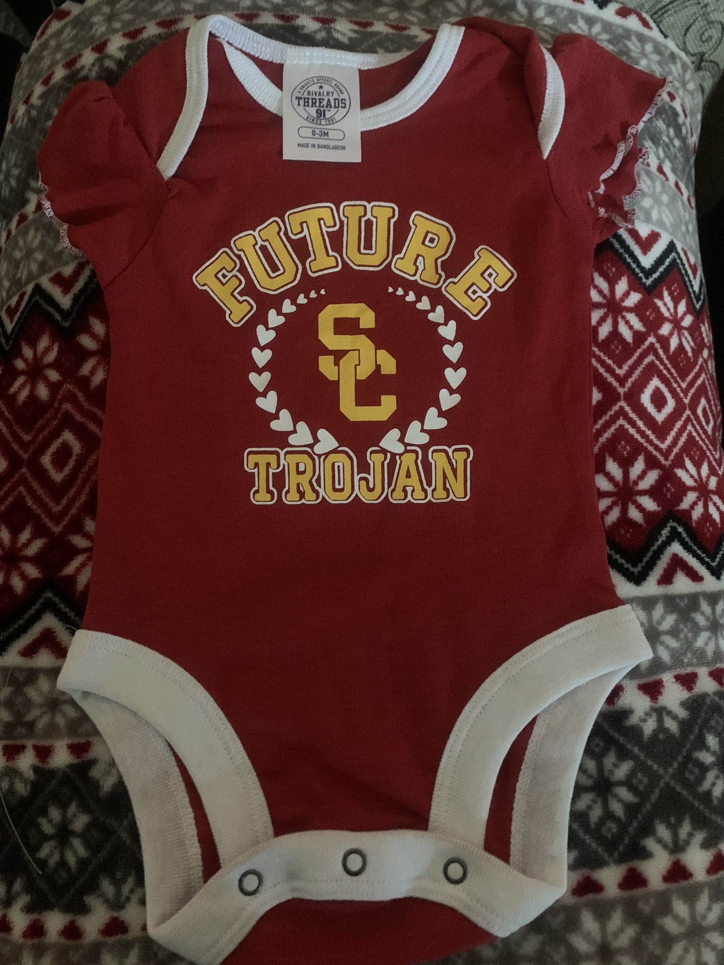 USC Baby Onesie And Piece Of Fabric