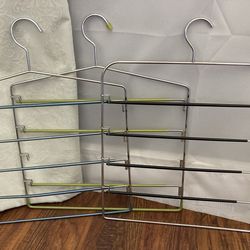 Three Chrome Pants Hangers With Movable Gripper Arms. pants organizer hanger