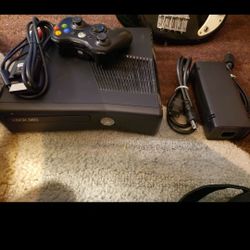 Xbox 360 Slim With Controller And Cords Working Perfectly In Every Way.