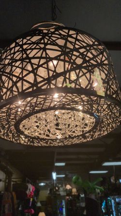 Gorgeous chromed out "Inca Round Pendant" adjustable chandelier with hanging crystals measures 8 in tall. 16 in across