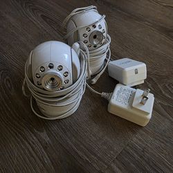 Two Infant Optics baby monitor cameras