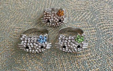 Lot of 3 Hello Kitty Rhinestone Ring silver  In excellent condition Size 8 (adjustable)