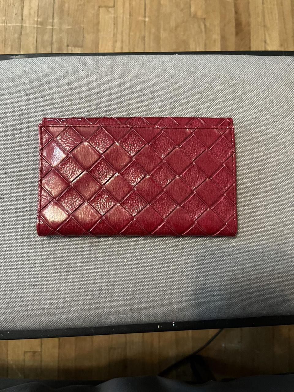 Red Estée Lauder three fold wallet with mirror