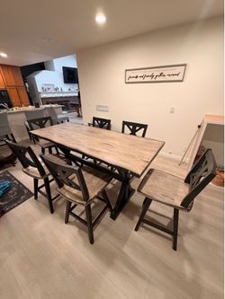 Counter height table and 6 swivel chairs