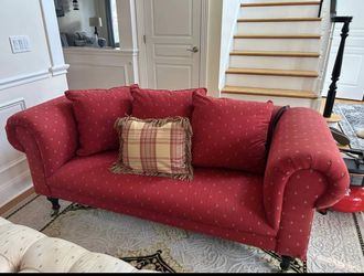 Red Rolled Arm Sofa with Fleur-de-Lis Pattern